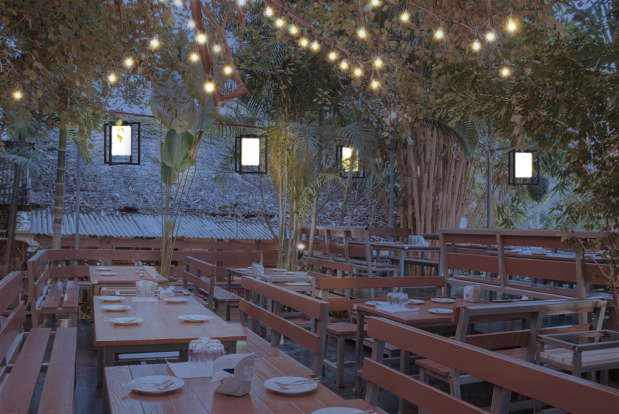 Visa Lighting's Laterna outdoor catenary light hung over restaurant patio at night