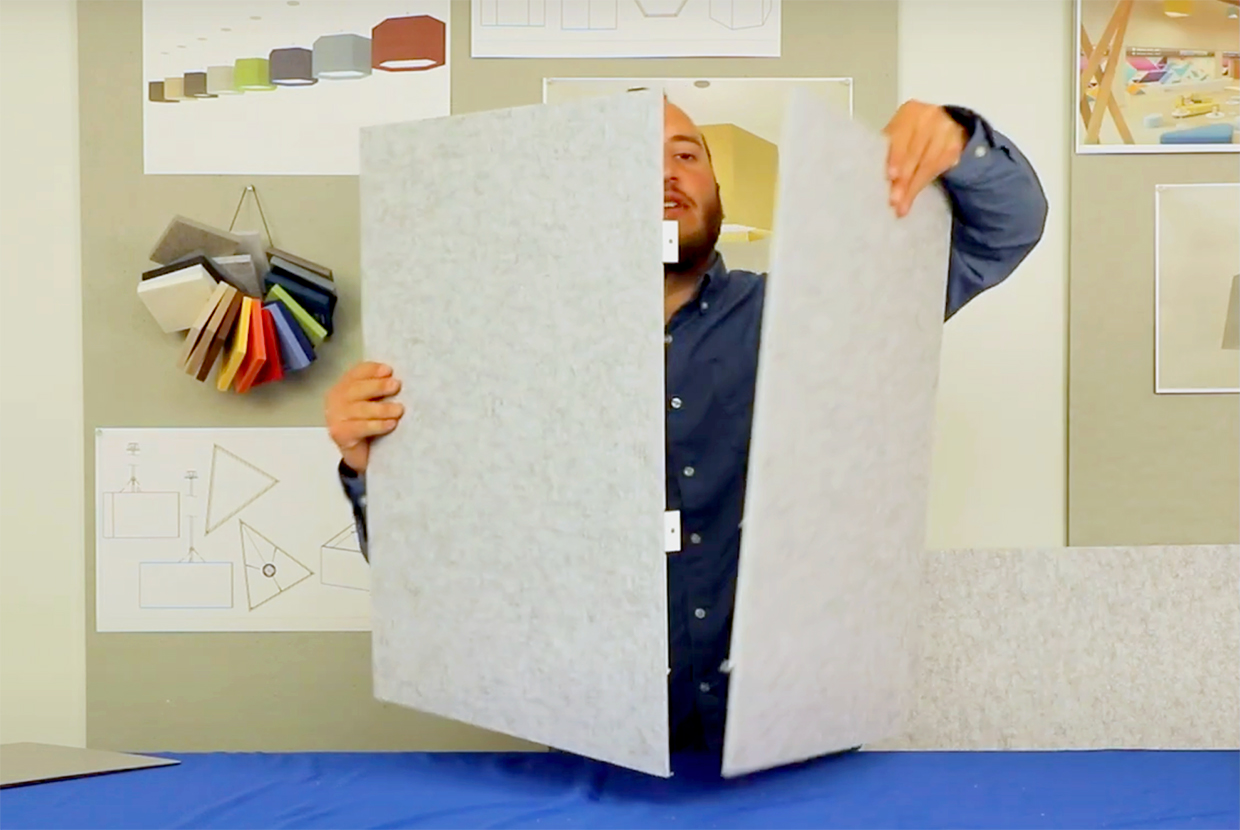 Product engineer hold up acoustic panel assembly for Celest pendant light.